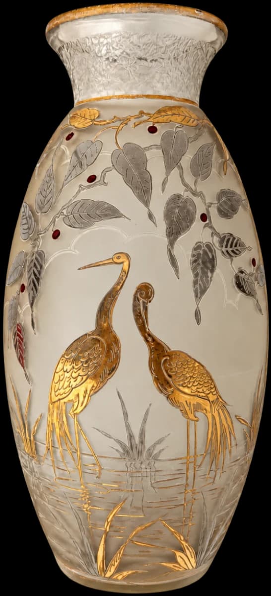 Translucent vase decorated with two gilded birds, leaves and red berries